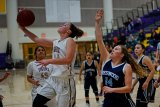 Lemoore's Katlyn Cole scores in Tuesday's game against Redwood High School.